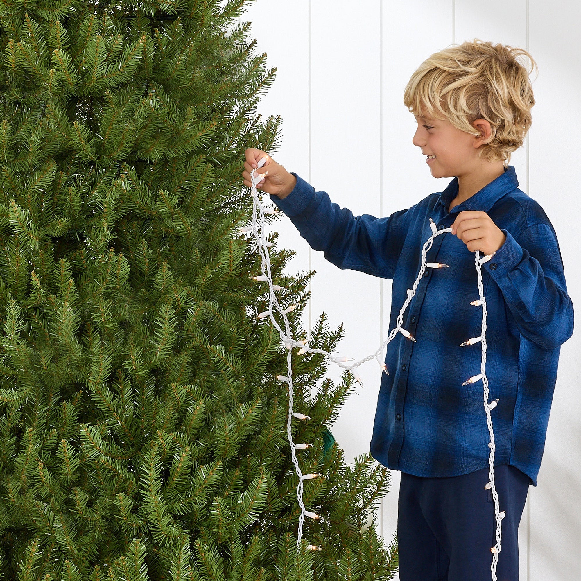 Premium Artificial Nordic Fir Hinged Christmas Tree with Foldable Metal Base for indoor and outdoor holiday displays